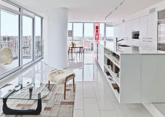 Redeveloper Apartment living area and kitchen with view of balcony