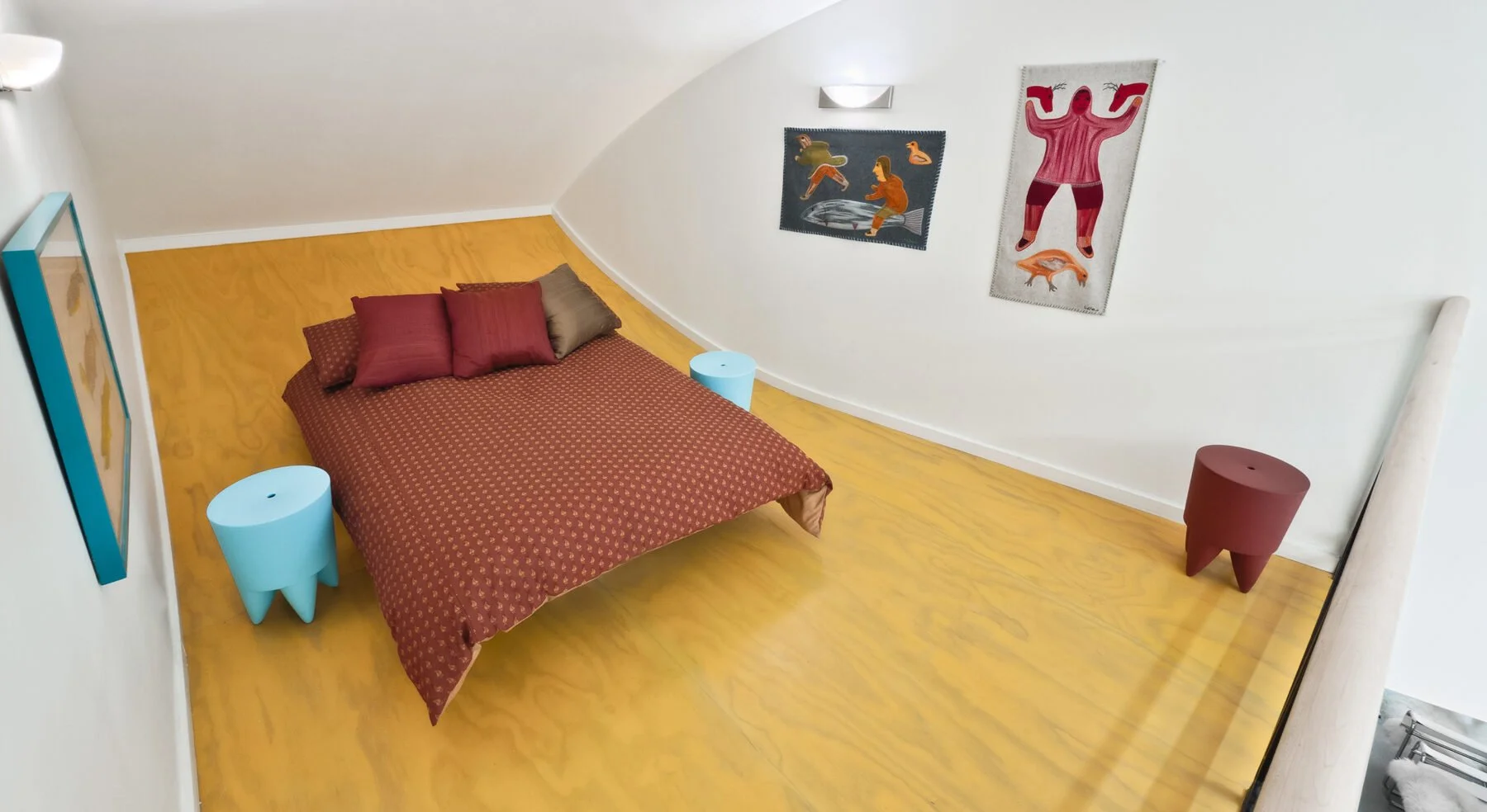 Curved-view of Hill-Maheux Cottage master bedroom loft